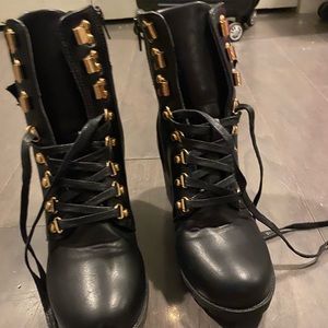 Heeled leather combat boot with gold detail